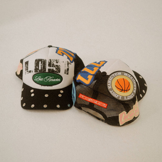LOST LOGO MULTI PATCH TRUCKER HAT